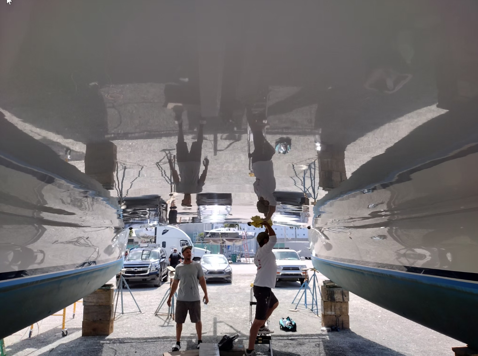 Locals Dockside Service team polishing a yacht in Riviera Beach, FL